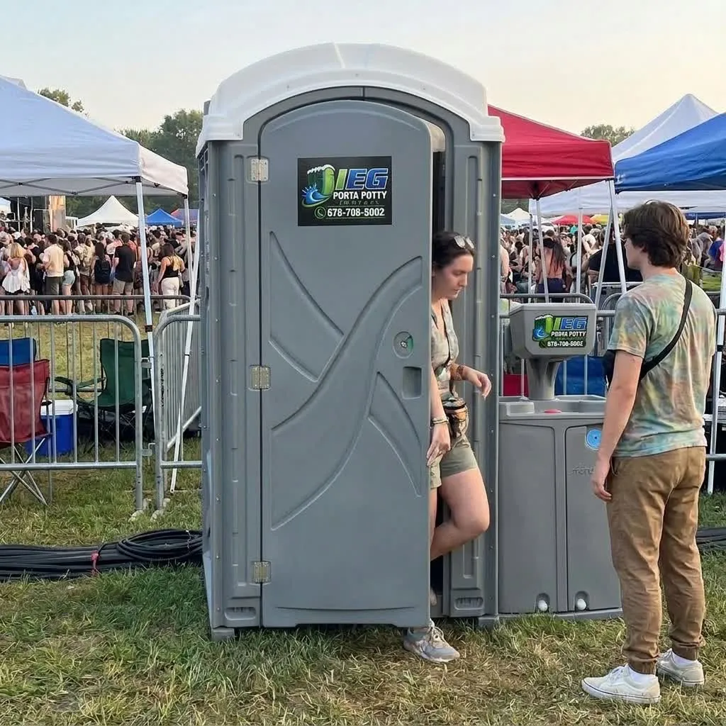 A luxury restroom trailer set up at an outdoor music festival.